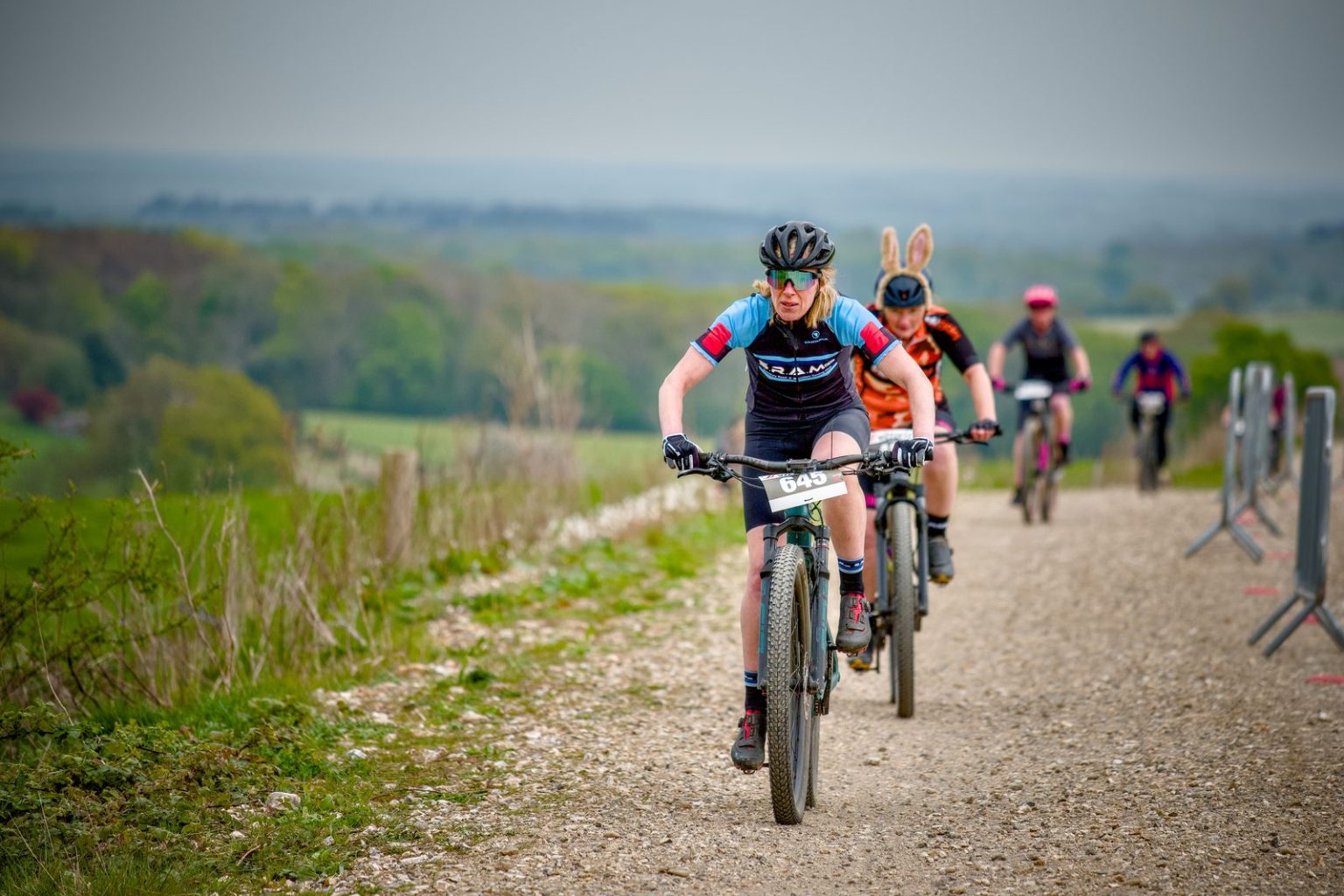 A SRAMcc rider leading a climb on a chalk track