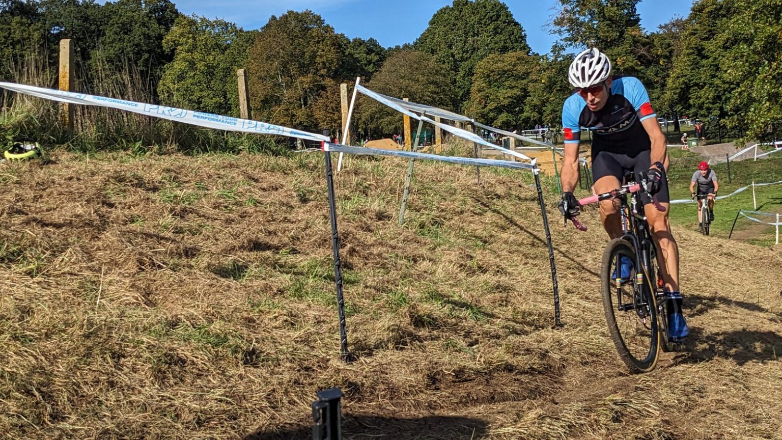 A SRAMcc rider on a cyclocross course